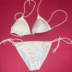 new without tags white bathing suit from Venus. Never worn.